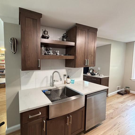 Alexandria VA kitchen design with dark cabinetry, farmhouse sink, and quartz countertops