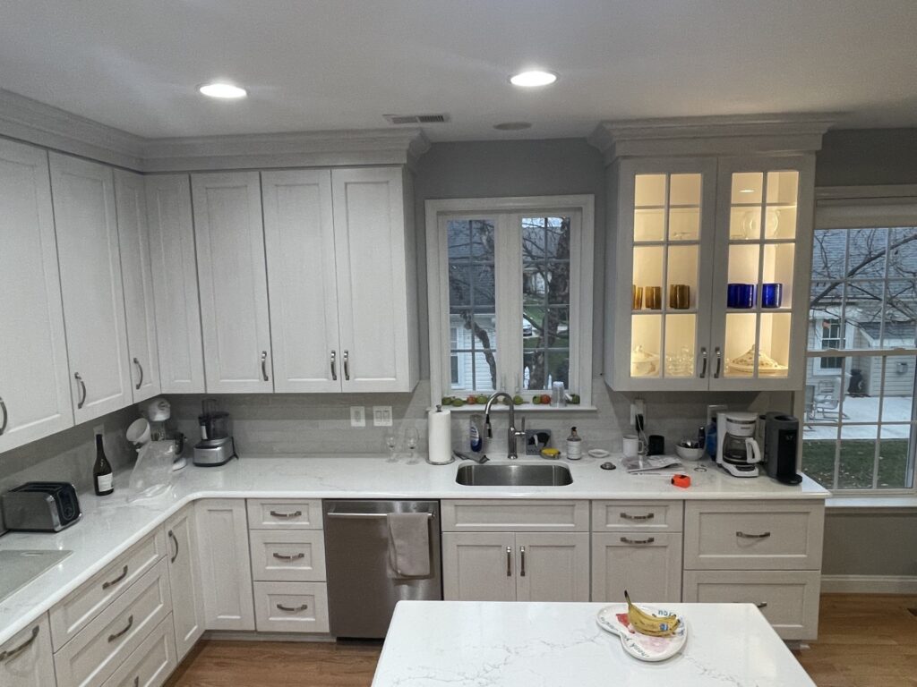 Kitchen remodel in Gainesville VA with white cabinetry and sink wall layout