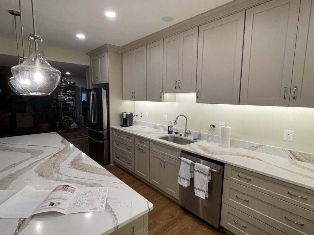 Basement kitchen remodel in McLean VA with custom cabinetry, large island, and quartz countertops