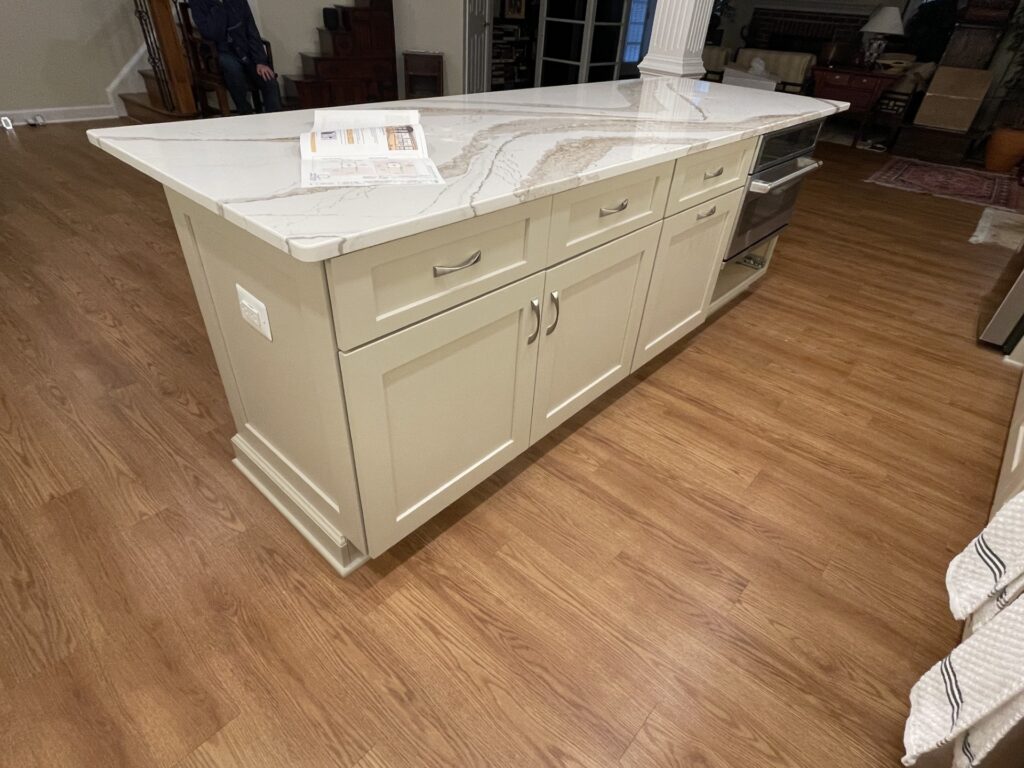 Large island with custom cabinetry in McLean VA basement kitchen remodel