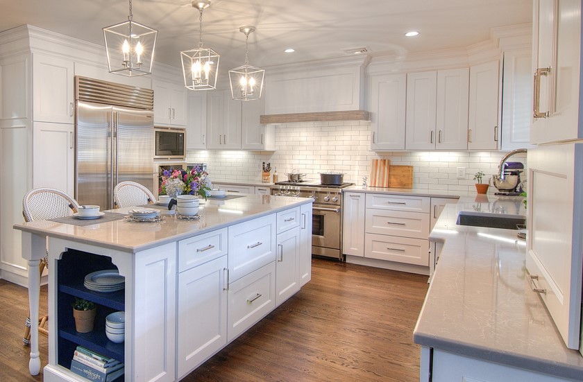 South Riding VA kitchen remodel with white cabinets, center island, stainless appliances, subway tile backsplash, and hardwood floors