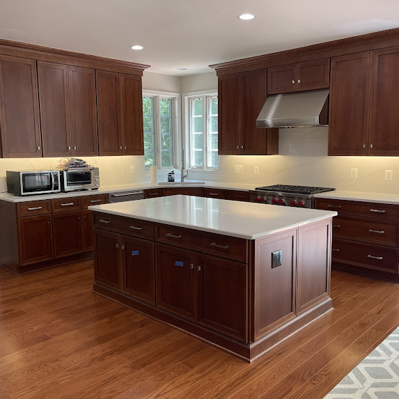Kitchen island workspace with dark cabinets in Springfield VA remodel
