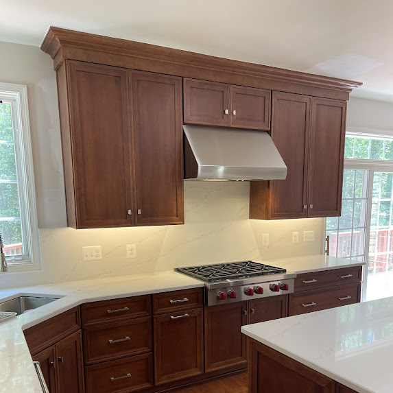 Springfield VA kitchen remodel with custom range hood and dark cabinetry