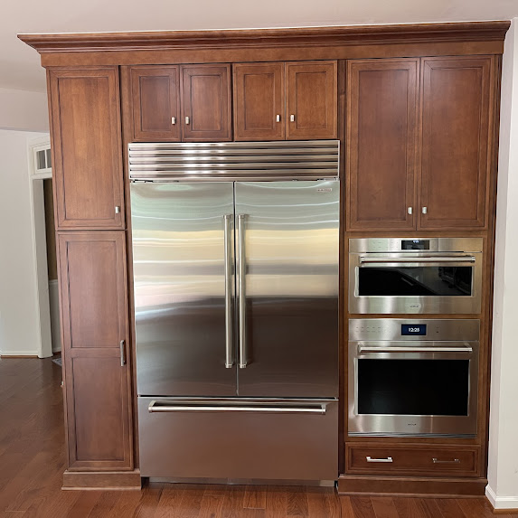 Kitchen remodel Springfield VA refrigerator wall with built-in cabinetry