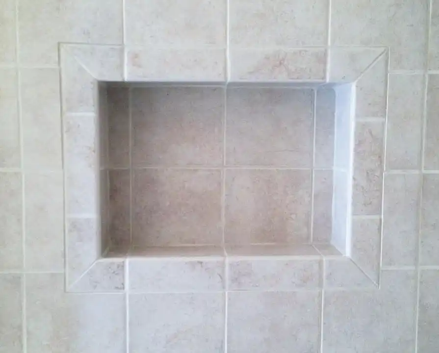 Gainesville VA bathroom remodel with recessed tile shower niche and beveled tile trim