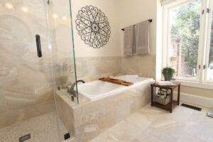 Haymarket VA primary bathroom remodel with glass tile shower, soaking tub, and large window