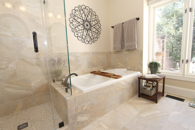 Haymarket VA primary bathroom remodel with glass tile shower, soaking tub, and large window