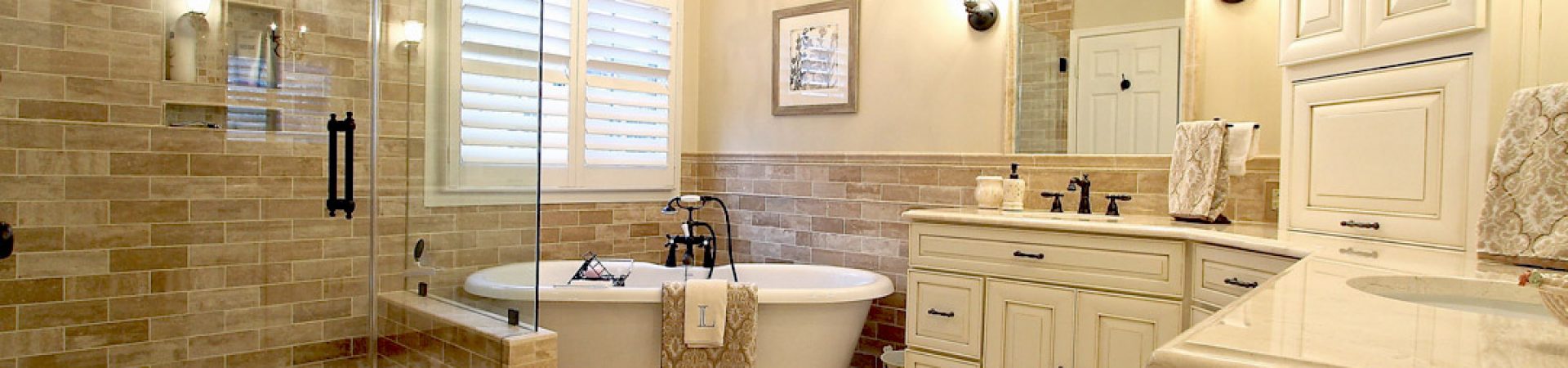 Gainesville VA primary bathroom remodel with tile shower, freestanding tub, double vanity, and custom cabinetry